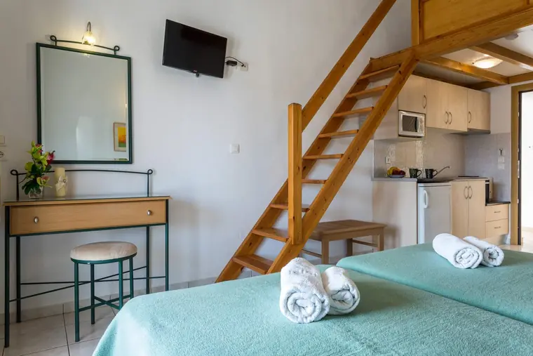 Dressing table, kitchenette and the stairs to the loft